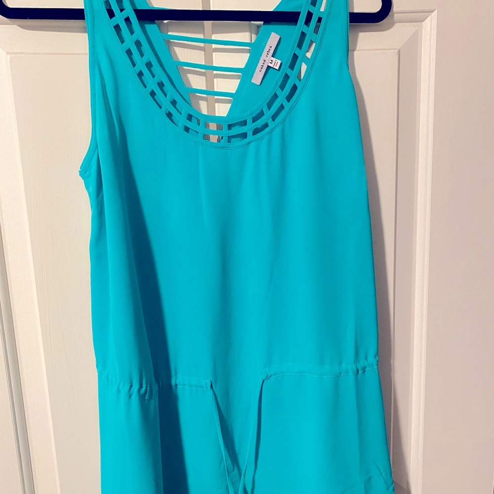 Naked zebra adjustable peplum, cut out back and caged design green blouse